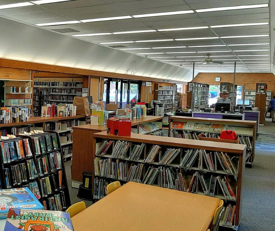 Inside of 1970s built library with brown brick and wooden accents