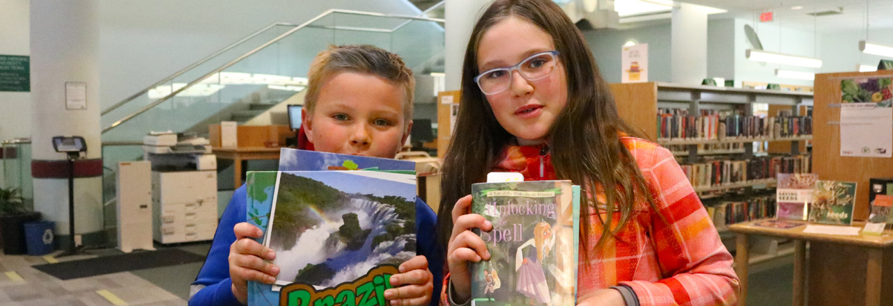 children holding books