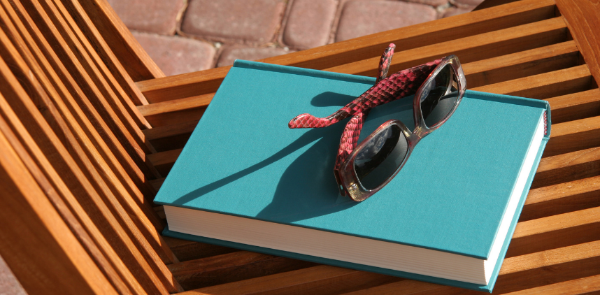 photo of a pair of sunglasses on a book