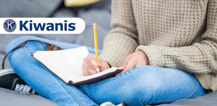 photo of a young person writing