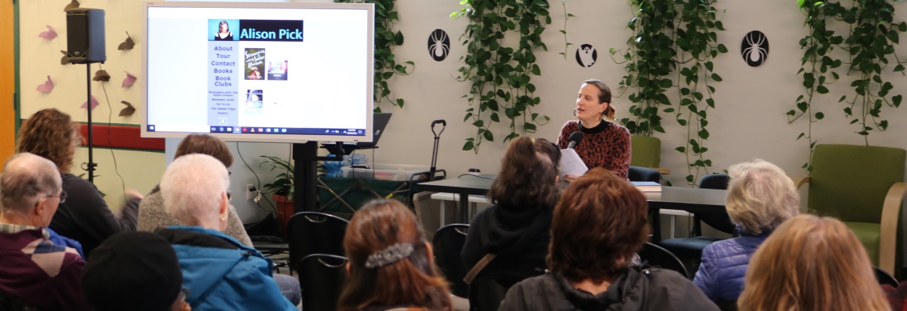 Woman giving a visual presentation to audience